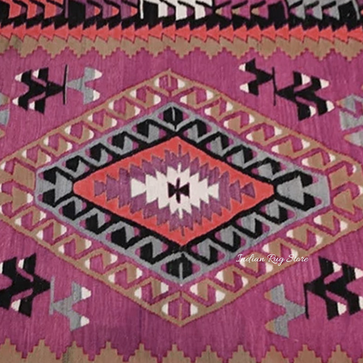 Alfombra de yute y lana tejida a mano con motivos geométricos multicolores en marrón óxido