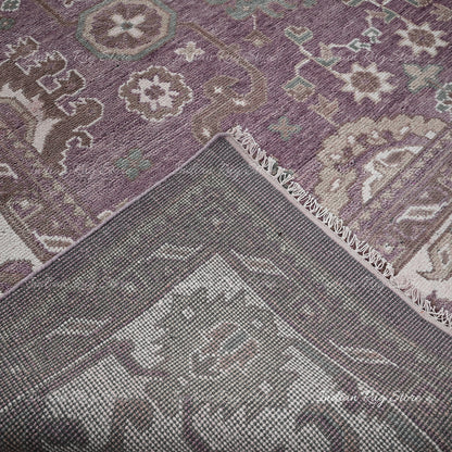 A close-up of an Oushak rug