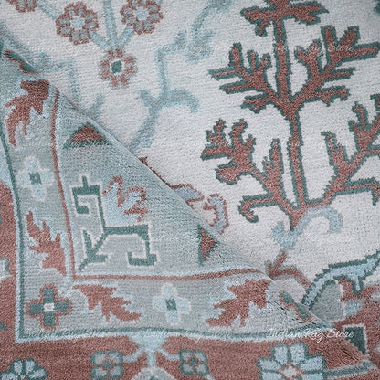 A close-up of a vintage Oushak rug