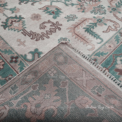 A close-up reveals the elegance of an Oushak rug.