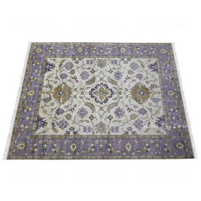 A spacious area featuring an Oushak rug