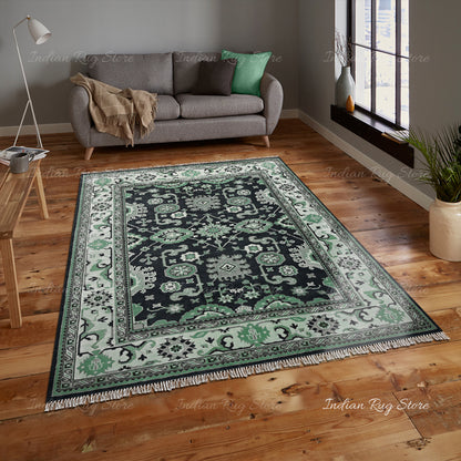 A warm, inviting space with a plush Oushak rug and soft cushions on the sofa.